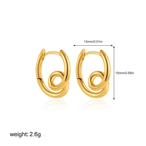 Detailed view of 18K gold spiral hoop earrings with dimensions 13mm by 15mm and 2.6g weight