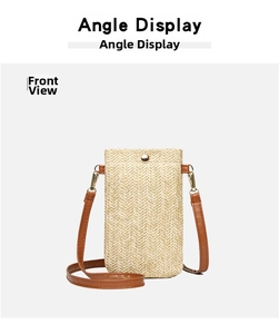 Front view of vertical woven straw phone bag with brown leather strap and gold hardware