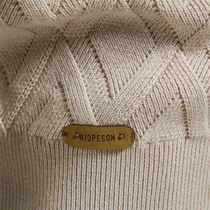 Beige crew neck sweater for men with diamond knit texture and leather brand tag