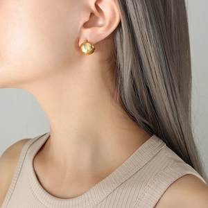 Elegant minimalist gold C-shaped hoop earrings for women with a smooth metallic finish