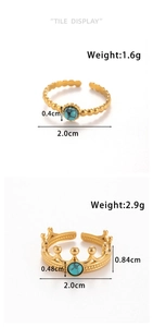 Detail of golden stainless steel rings with crown design and turquoise inlay settings