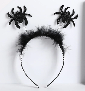 Detail of Halloween spider headband with black feathers and sparkly glitter spring antennas