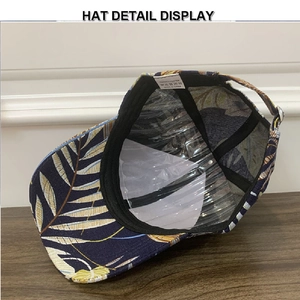 Detail view of the navy blue baseball cap interior showing sweatband and washing label