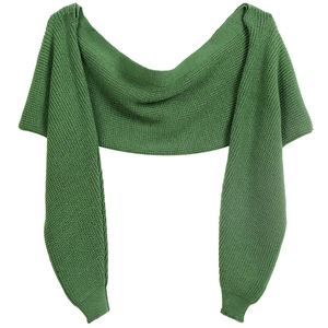 Detail view of green knitted shrug with textured fabric for women on white background