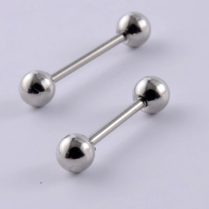 Polished stainless steel barbell studs for cartilage piercing on a purple background