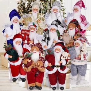 Close-up of assorted festive faceless gnome dolls with various colorful Christmas outfits