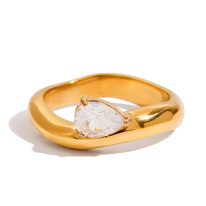 Detailed view of a gold-plated ring featuring a pear-cut clear cubic zirconia stone