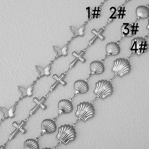 Detail of silver stainless steel butterfly and shell charms for DIY jewelry making