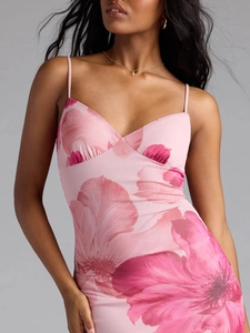 Close-up of pink floral print on V-neck mesh dress with delicate spaghetti straps
