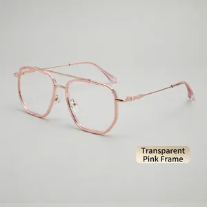 Detail of transparent pink polygon frame with rose gold metal temples and double bridge