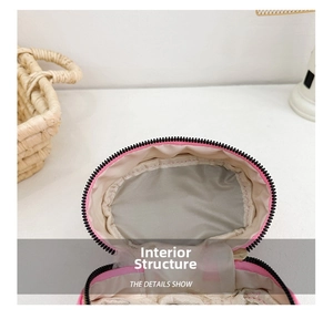Detail view of pink bow bag interior featuring grey lining and durable zipper closure