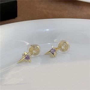 Detailed view of golden star clip-on earring with purple heart stone and silicone pad
