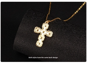 Macro detail of the gold cross pendant back showing geometric segments and linkage