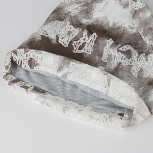 Brown and white tie-dye knit beanie with artistic letters and grey lining