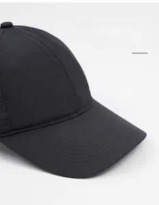 Detail of wide brim black baseball cap with durable stitching and quick-dry mesh fabric