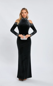 Detail of elegant black velvet dress with beaded pearls on the collar and shoulders