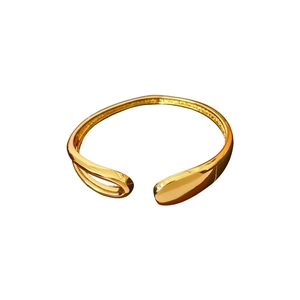 Minimalist gold-plated open bangle featuring a polished organic waterdrop design for women
