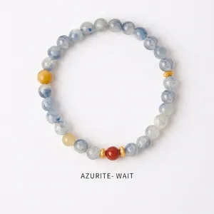 Detailed view of azurite beaded bracelet with golden spacers and natural textures