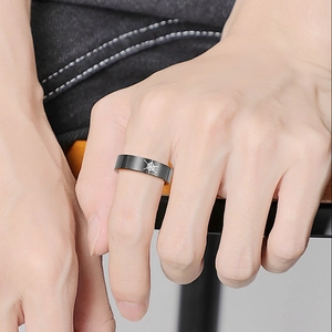 Fashionable titanium steel spider web ring with black finish and star pattern on finger