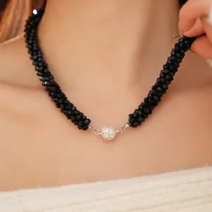 Elegant beaded black crystal necklace featuring a round sparkling magnetic rhinestone clasp