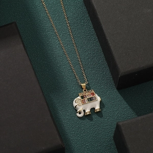 Gold elephant necklace featuring white enamel and colorful cubic zirconia stones