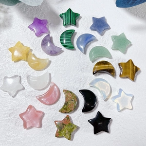 Macro shot of colorful star and moon shaped natural crystal stones in a circular layout