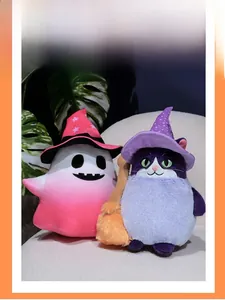 Detail of Halloween plush toys featuring a pink ghost and a purple wizard cat with broom