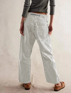 Detail showing back pockets and adjustable drawstring on grey striped wide-leg trousers