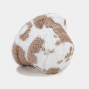 Close-up of fluffy cow print bucket hat showing soft faux fur texture and brown spots
