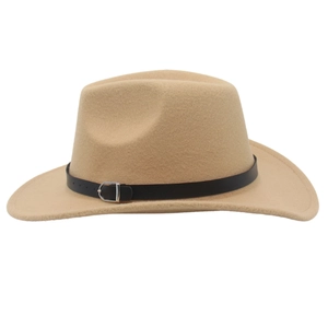 Close-up of camel wool felt cowboy hat with black leather band and silver buckle detail