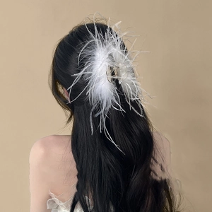 Elegant white ostrich feather hair claw clip for long hair shown from a back view