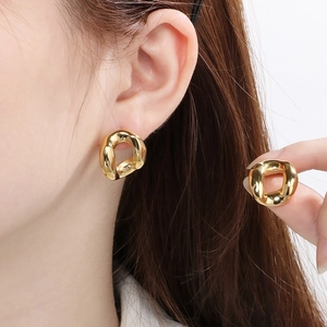 Modern 18K gold plated stainless steel irregular geometric earrings on female model
