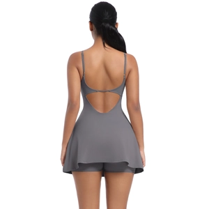 Rear view of grey athletic dress showing open back design and built-in shorts