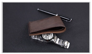 Brown leather wallet in a professional business setting with watch and pen accessories