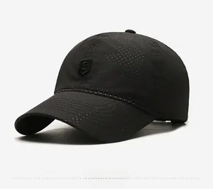 Detail of breathable perforated fabric on black quick-dry sport baseball cap