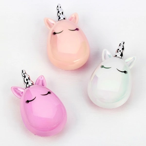 Three-piece set of unicorn-themed hair combs in pink and white with 3D spiral horns
