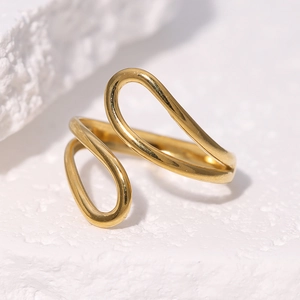 Minimalist double U-shaped open ring in polished gold stainless steel on stone