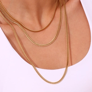 Three-layer stacked 18K gold plated foxtail chains shown on neck with high metal luster