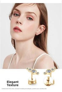 Detailed view of gold S925 sterling silver three-stone moissanite stud earrings