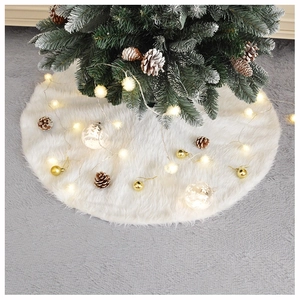 Detail of white long plush Christmas tree skirt with soft texture and festive scene