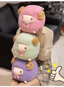 Close-up of fluffy plush sheep dolls in pink, green, and purple with golden embroidery