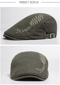 Detailed side view of cotton ivy cap featuring wave embroidery and adjustable metal buckle