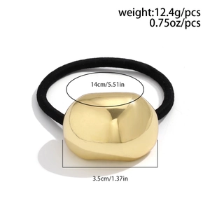 Detailed view of elastic hair tie with gold metallic oval charm and size measurements