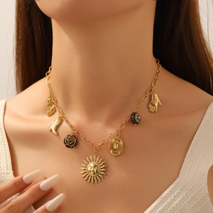 Vintage gold sun and acrylic charms chunky necklace with bohemian western style on a model
