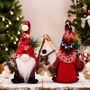 Detail of Christmas gnomes with knit hats, plaid vest, lantern and festive candy cane