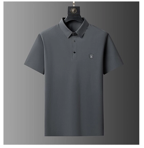 Close-up of high-elasticity dark grey polo shirt with shield embroidery and knit texture