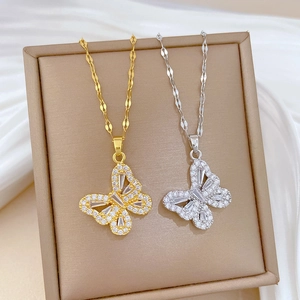 Luxe hollow butterfly pendant necklace with sparkling crystals in gold and silver finish