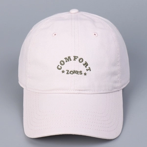 Detail of light pink cotton baseball cap with high-quality star and letter embroidery