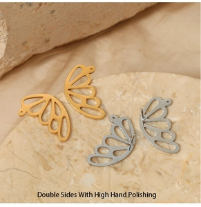 Detailed macro of 316 stainless steel butterfly wing earrings with double-sided hand polishing