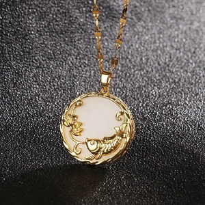 Minimalist gold-plated titanium necklace featuring white shell koi fish and lotus pendant